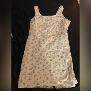 A white flower like dress with a slit in the back